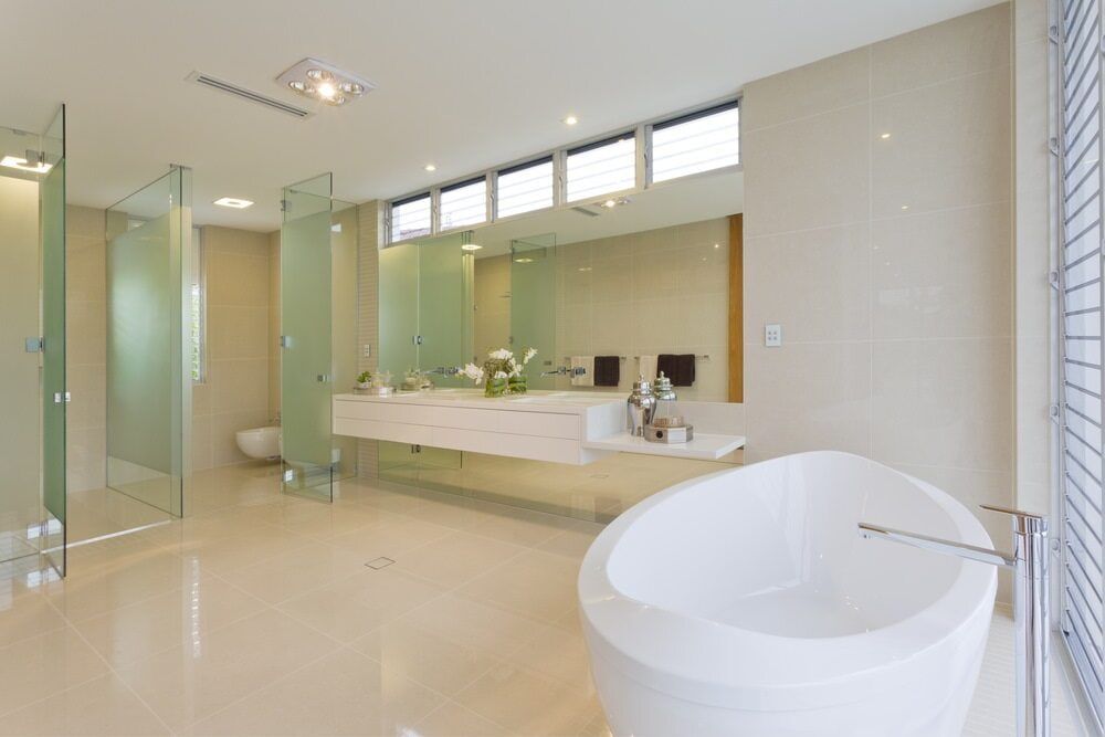 A Bathroom With A Tub, Sink, And Shower — South East Kitchens In Gold Coast, QLD