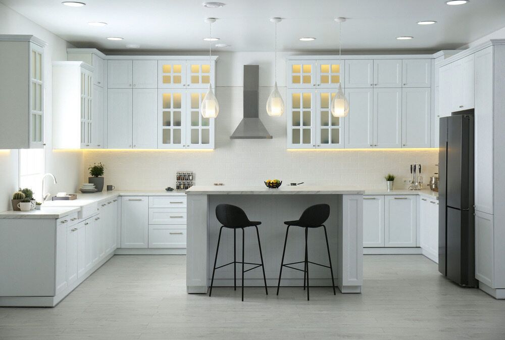 A Modern Kitchen With White Cabinets, Stools And A Refrigerator — South East Kitchens In Gold Coast, QLD
