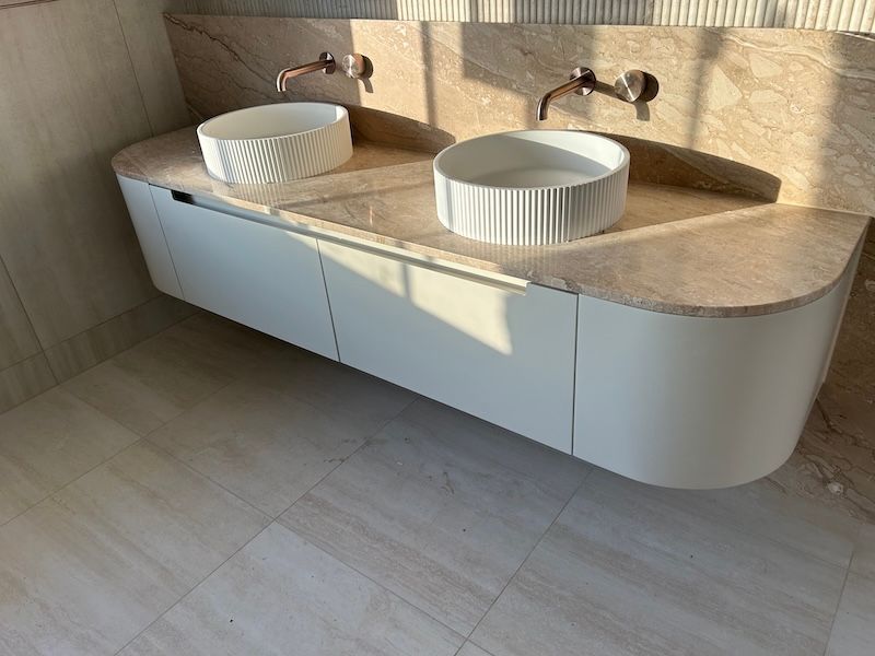 A Bathroom Floating Bench Gold Sink with Stone Cream Tiles - South East Kitchens, Burleigh Heads