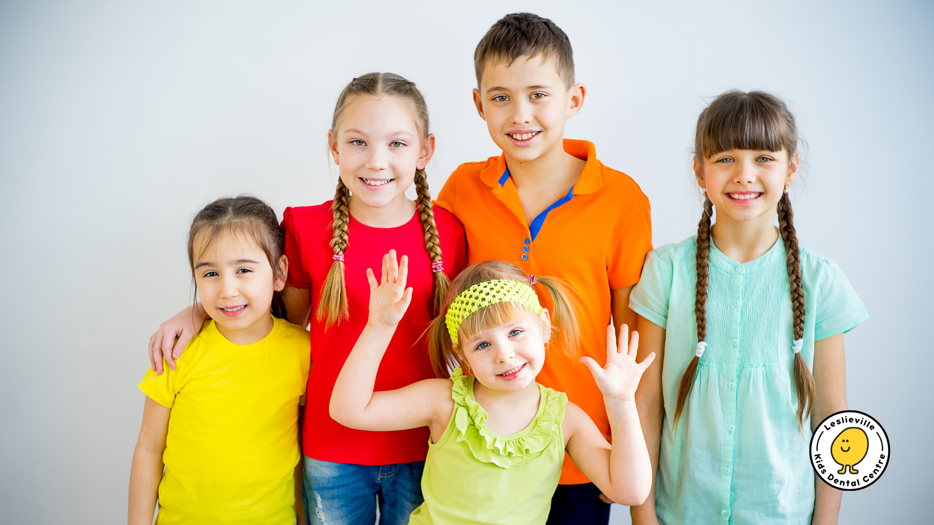 A group of children are posing for a picture together.