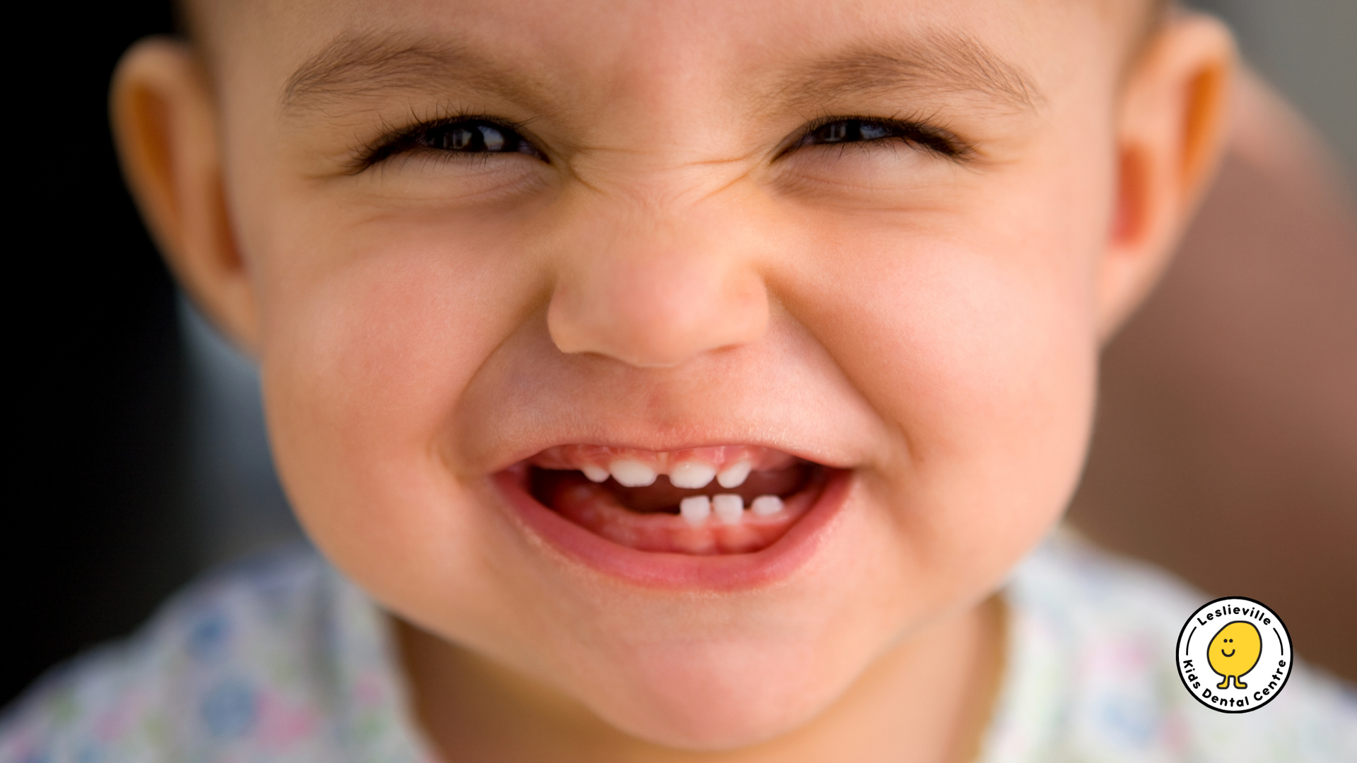 A close up of a baby making a funny face