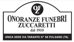 Black-and-white sign for Onoranze Funebri Zuccaretti, funeral services in Pulsano, Italy.