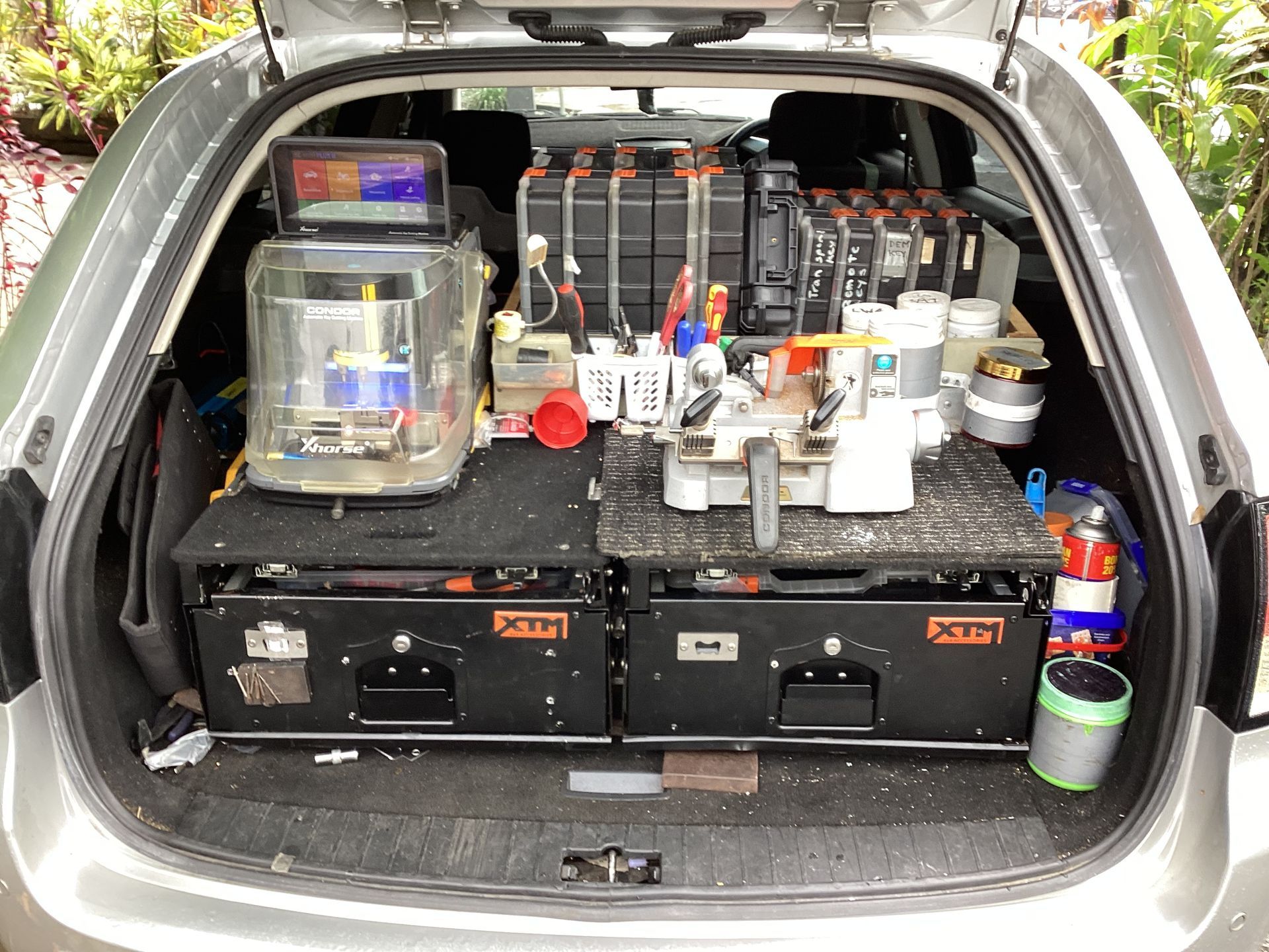The Trunk Of A Car Is Filled With Tools And Boxes — Cassowary Coast Locksmiths In East Feluga, QLD