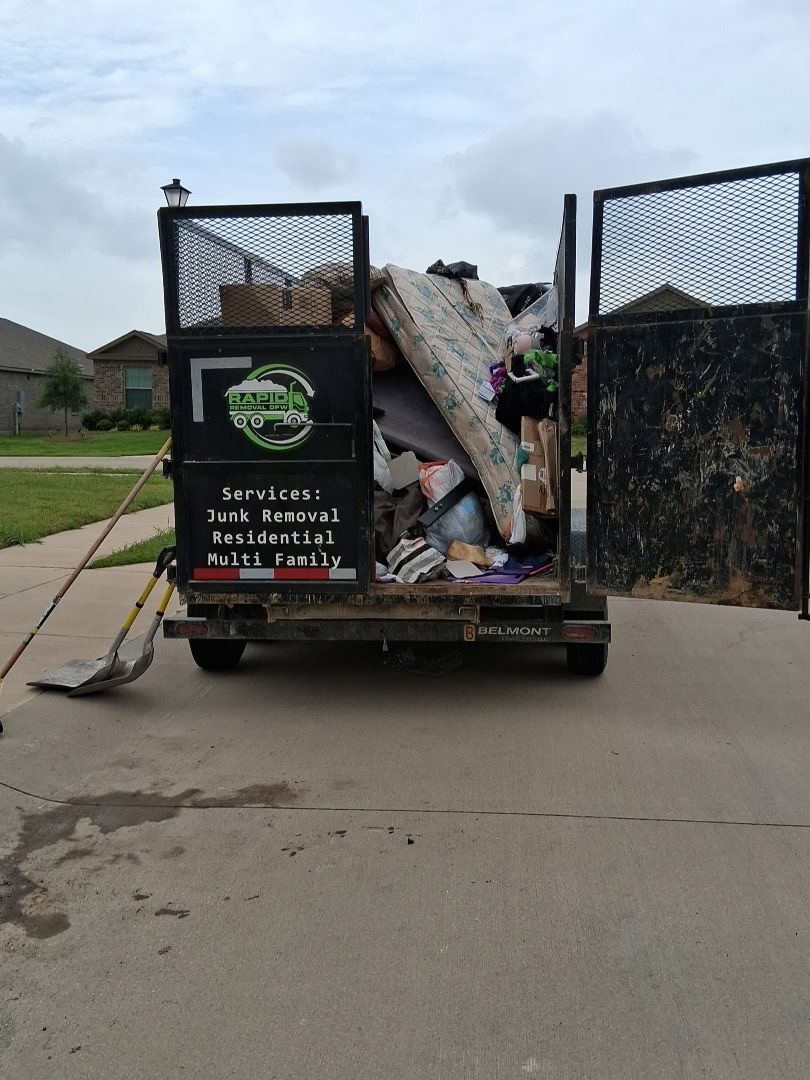 Us  loading old couch and mattress into junk removal into  truck in Richardson, TX