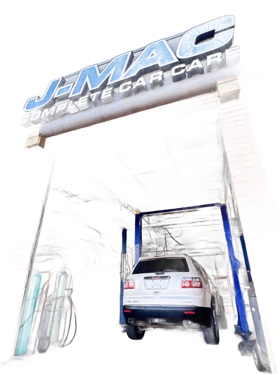 Vehicles on lifts inside the J-Mac Complete Car Care service bays