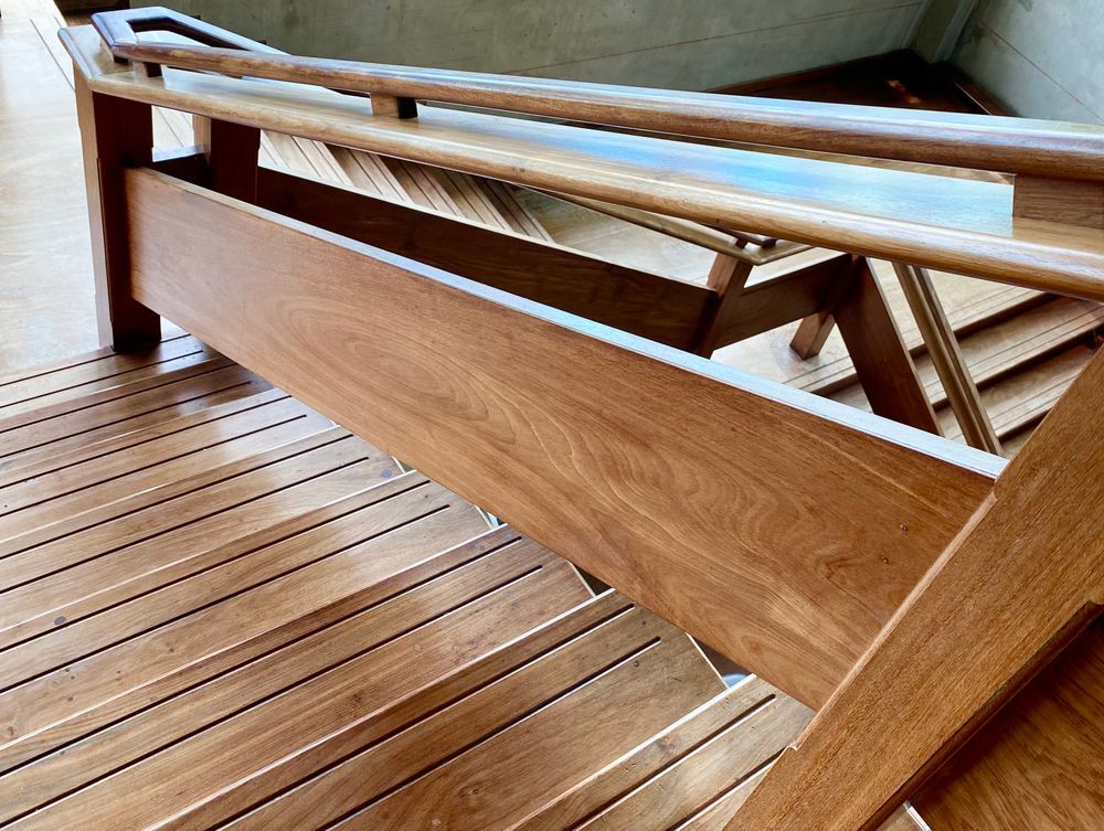 Wooden Bench With Slatted Seat and Angled Frame on a Wooden Deck — C K Carpentry in Byron Bay, NSW