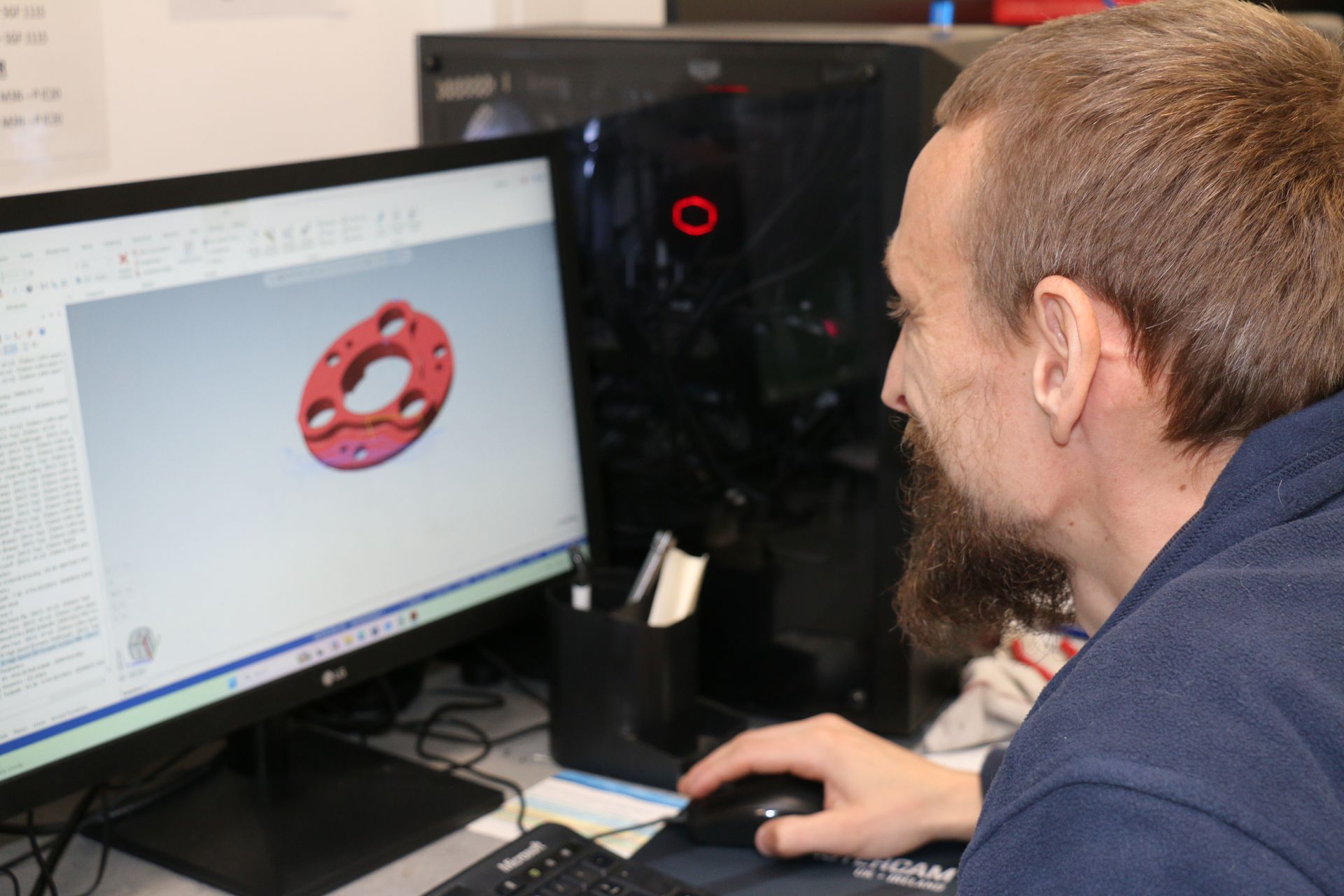 An engineer programming using CAM.