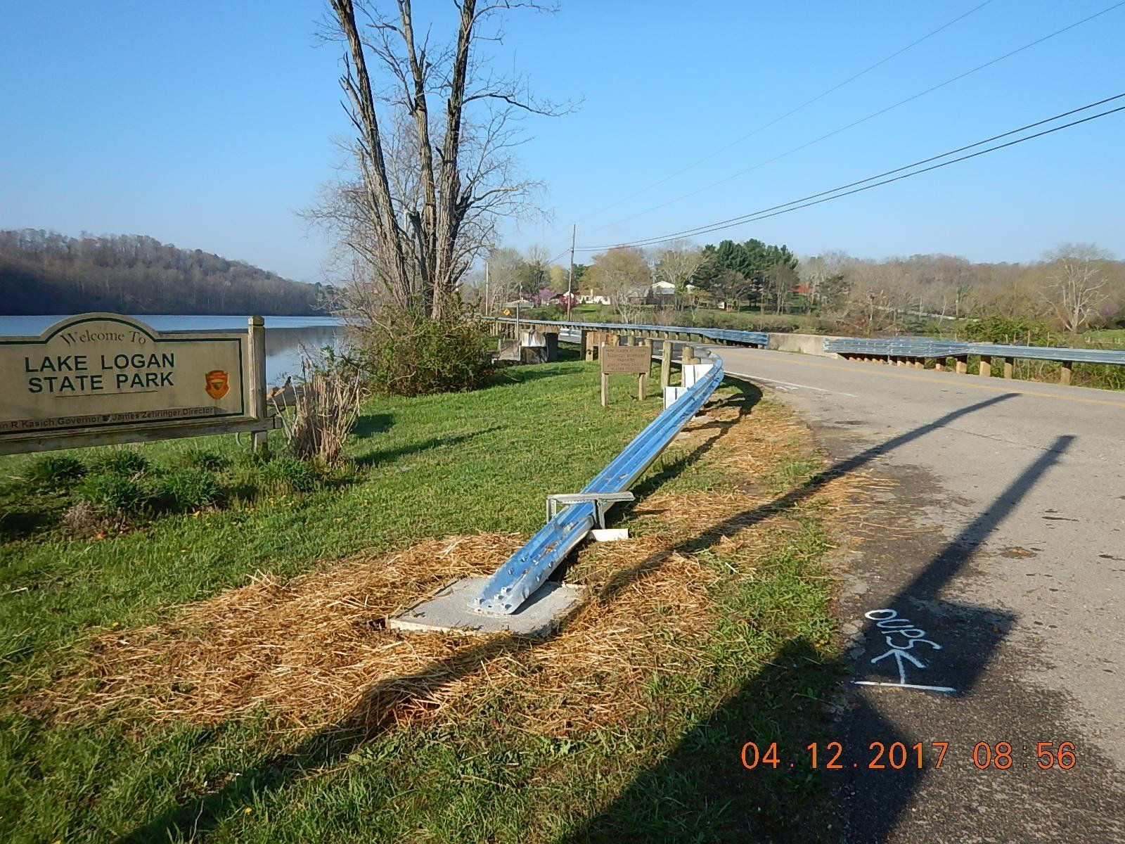 A sign that says lake logan state park on it