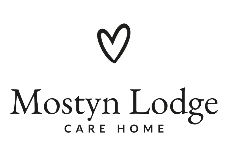 Logo for Mostyn Lodge Care Home: Heart above text, “Mostyn Lodge” and “CARE HOME.”