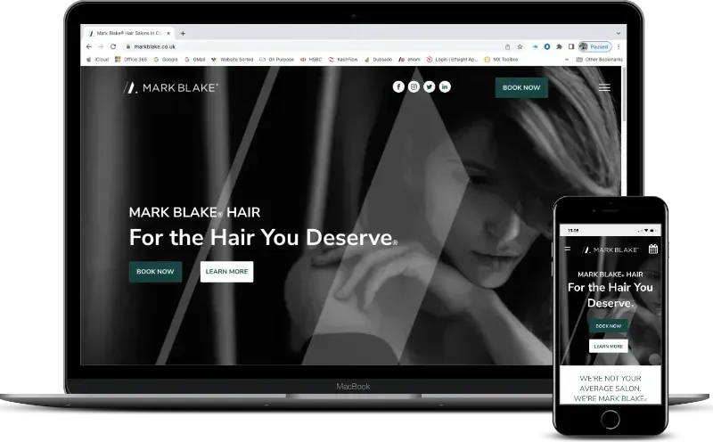 Website mockup on laptop and phone showing a hair salon homepage with a woman’s portrait and “For the Hair You Deserve” text