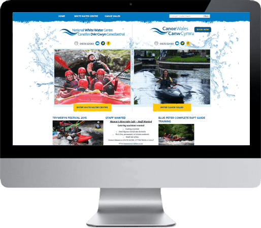 Website shown on a desktop monitor with rafting photos and yellow call-to-action buttons