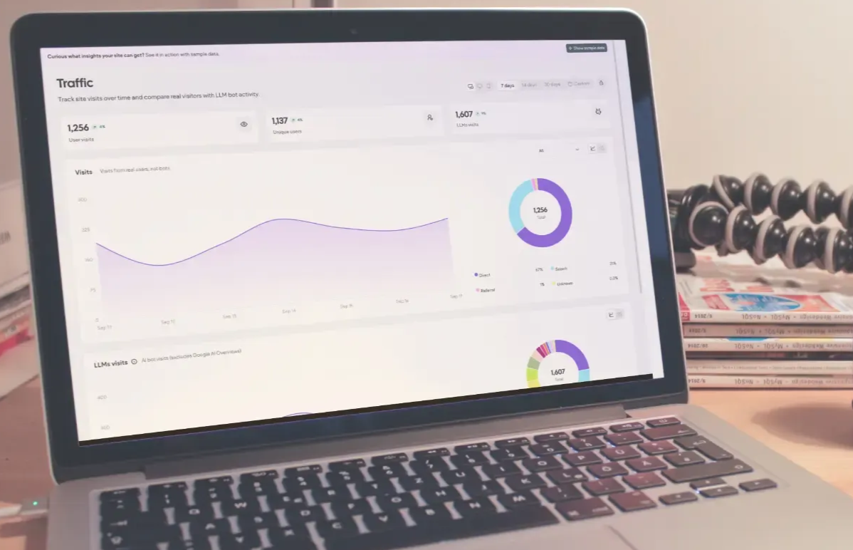 Laptop displaying an SEO analytics dashboard with a rising turquoise line graph on a white screen