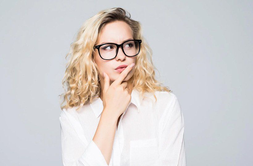 woman glancing at tms therapy and mental wellness information