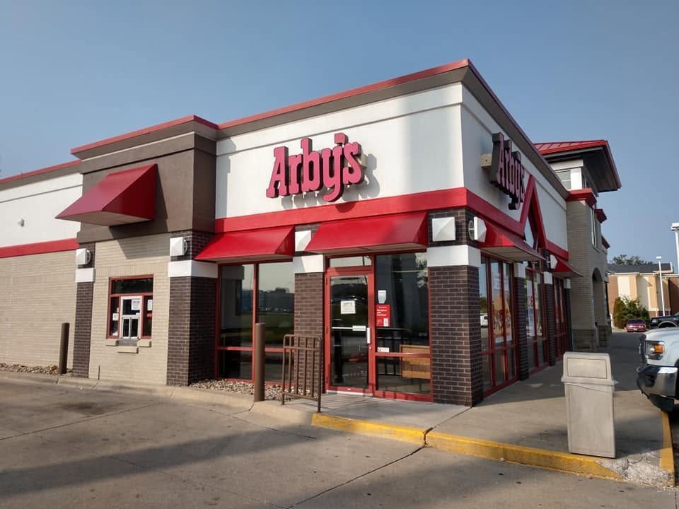 Arby’s fast-food restaurant exterior with red and white signage and a drive-thru window