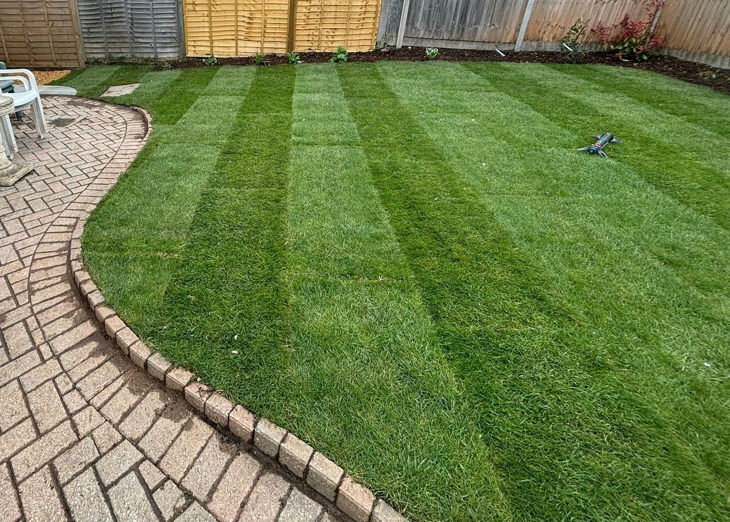 New turf laid with path to the left