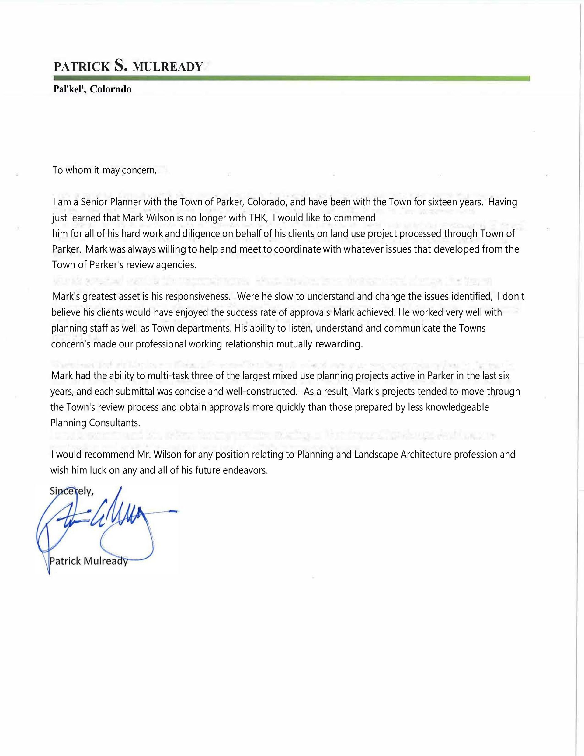 Blurry signed business letter on white paper with a green header line and blue handwritten signature.