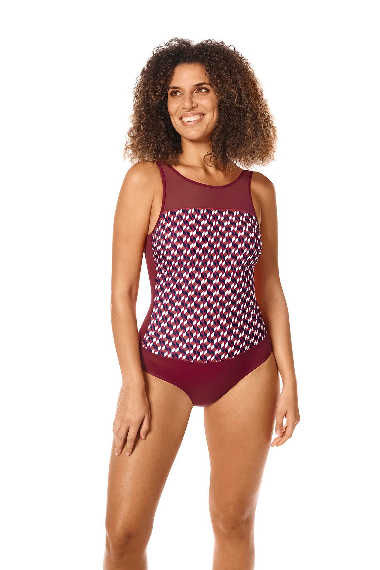 Woman in maroon and checkered swimsuit smiling.