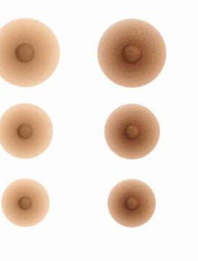 Six nipple covers in varying shades of tan arranged on a white background.