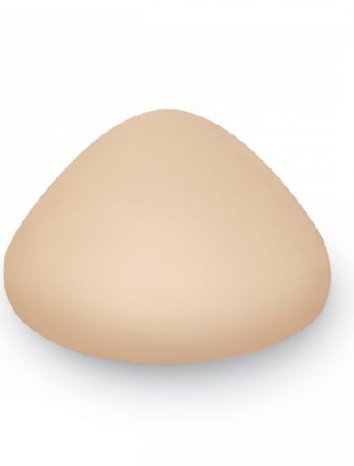 A teardrop-shaped beige breast form, likely for post-mastectomy use.
