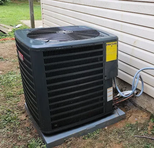 Outdoor HVAC condenser for AC repair and heating repair services