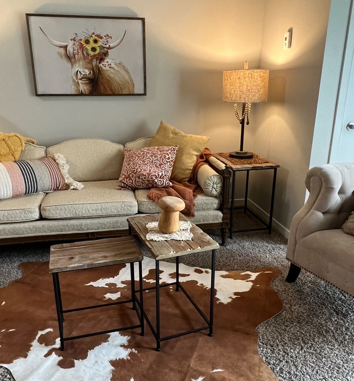 modern country themed living room with cow print rug