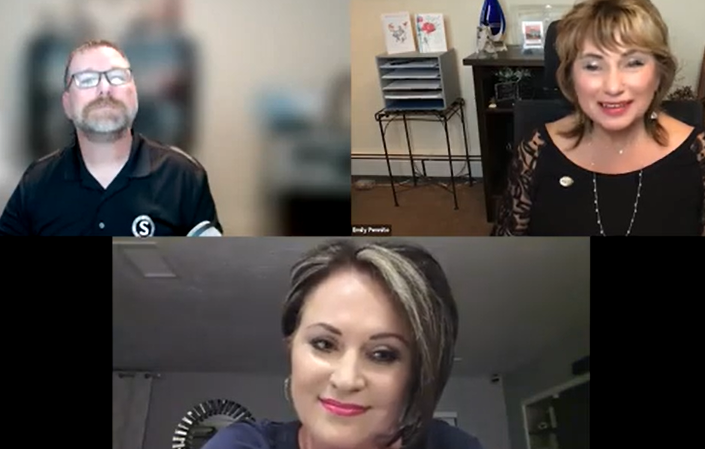 Three people on a video call. Middle woman, woman on right, and man on left appear to be in a discussion.