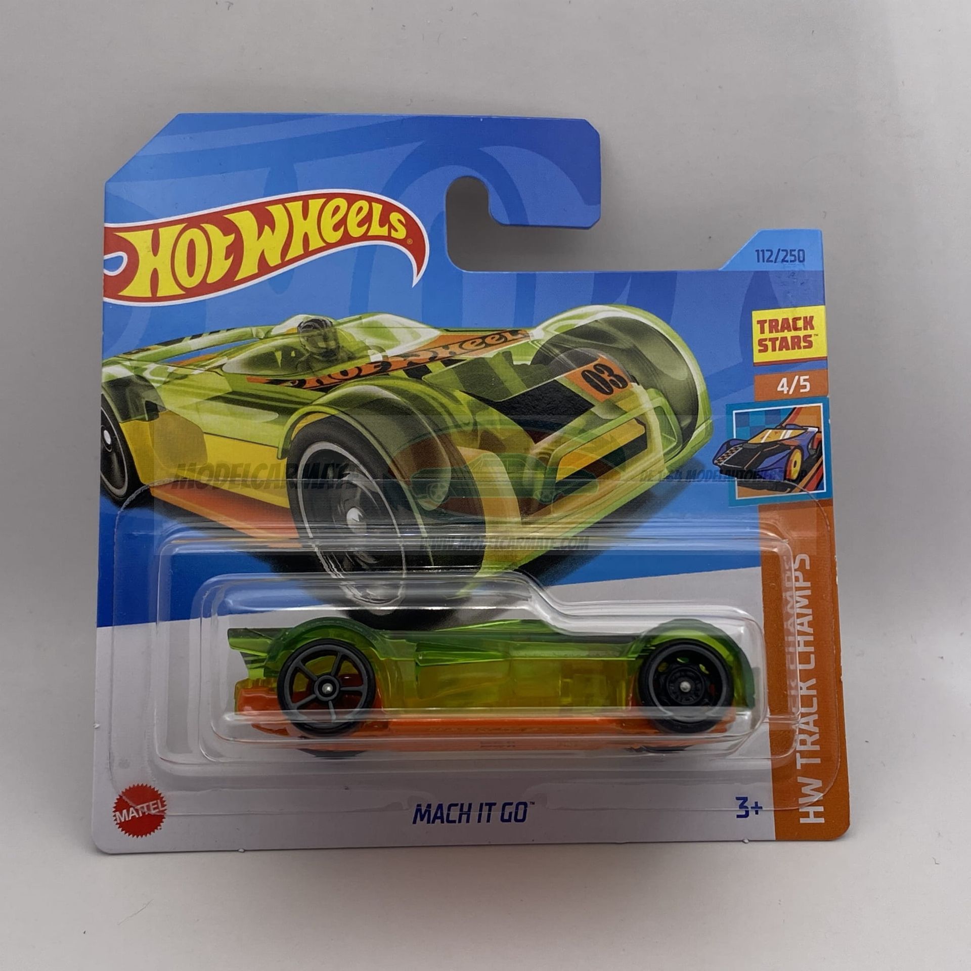 Hot Wheels auto in verpakking; groene en oranje Mach 1 '69 speelgoedauto.