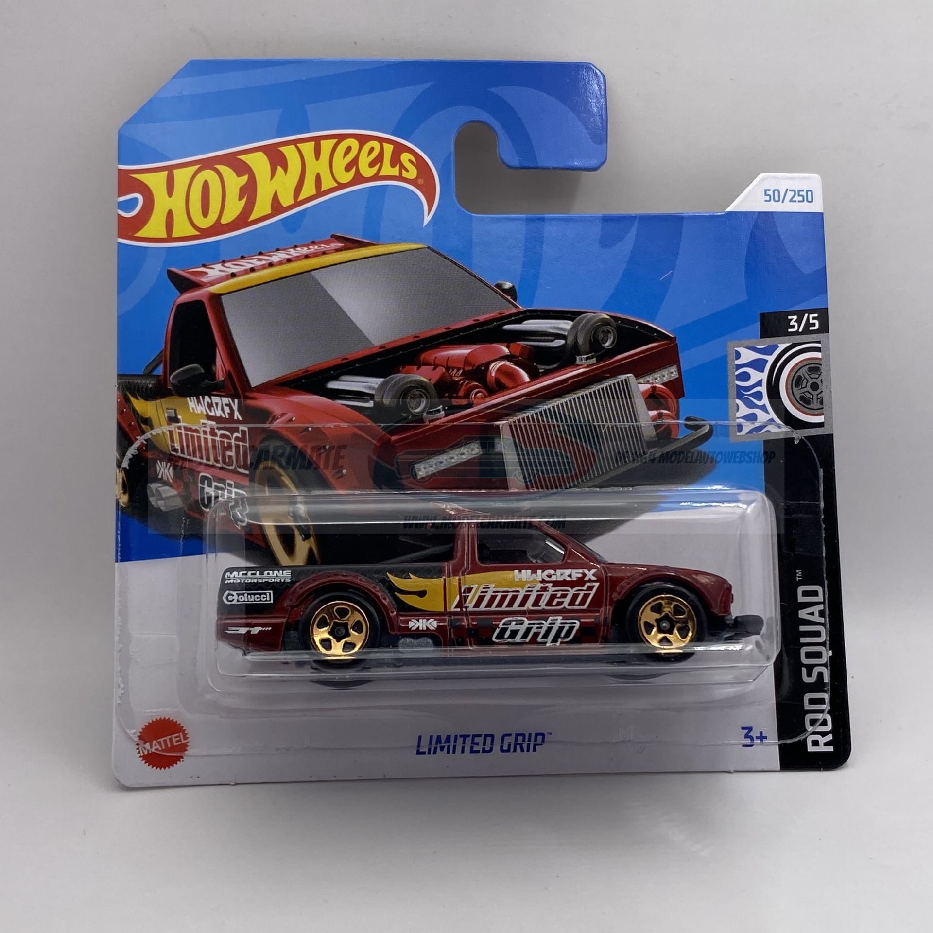 Hot Wheels speelgoedauto in verpakking, rode en gouden "Limited Grip" truck.