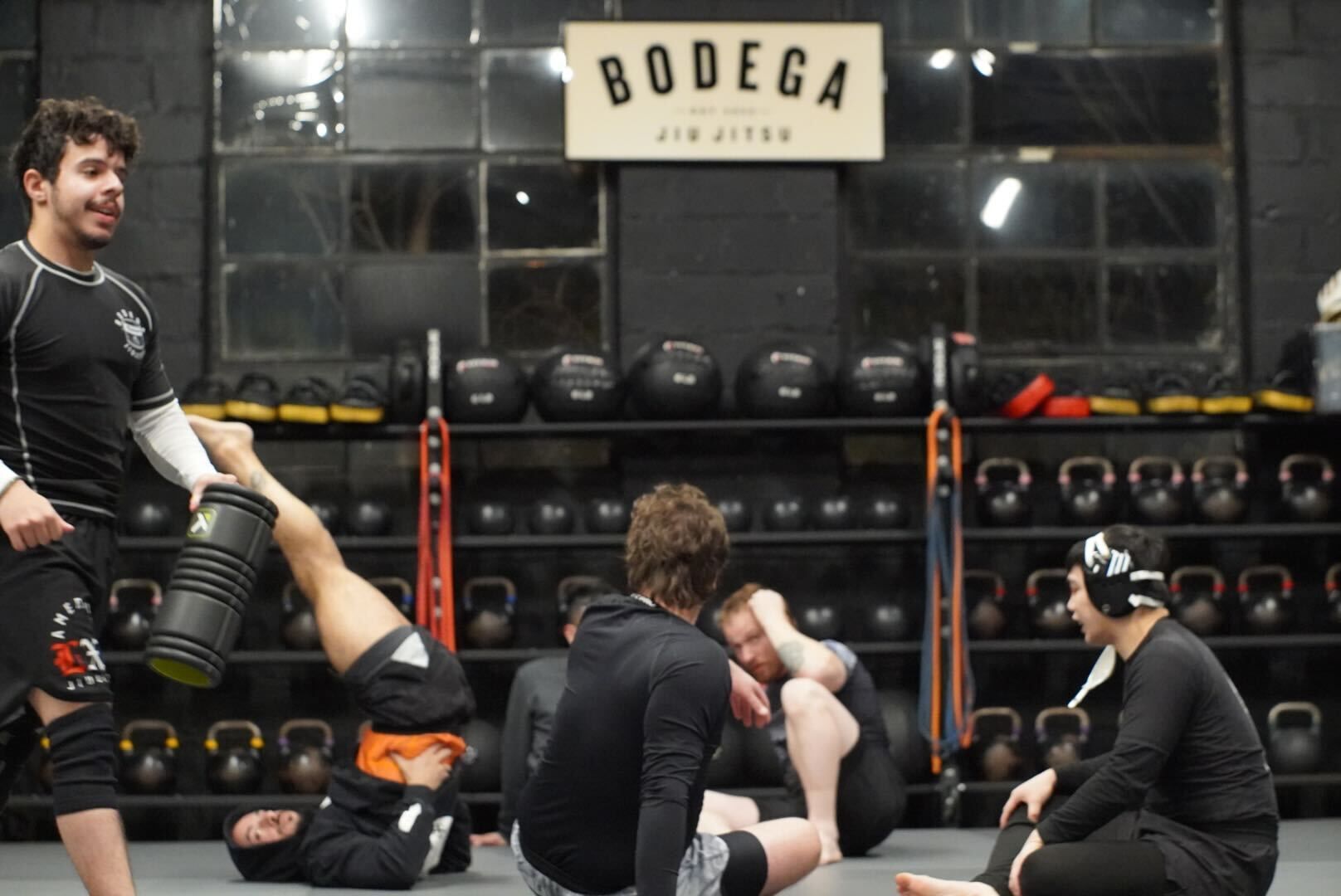 Adults drilling grappling technique at Bodega Jiu-Jitsu in Maplewood, NJ, building fitness and control on the mat