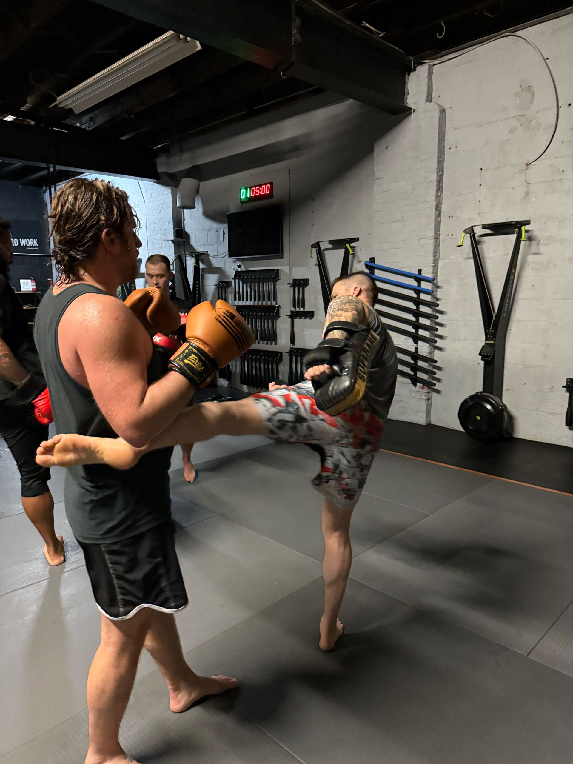 Adults practicing grappling drills at Bodega Jiu-Jitsu in Maplewood, NJ to build mobility and balance.