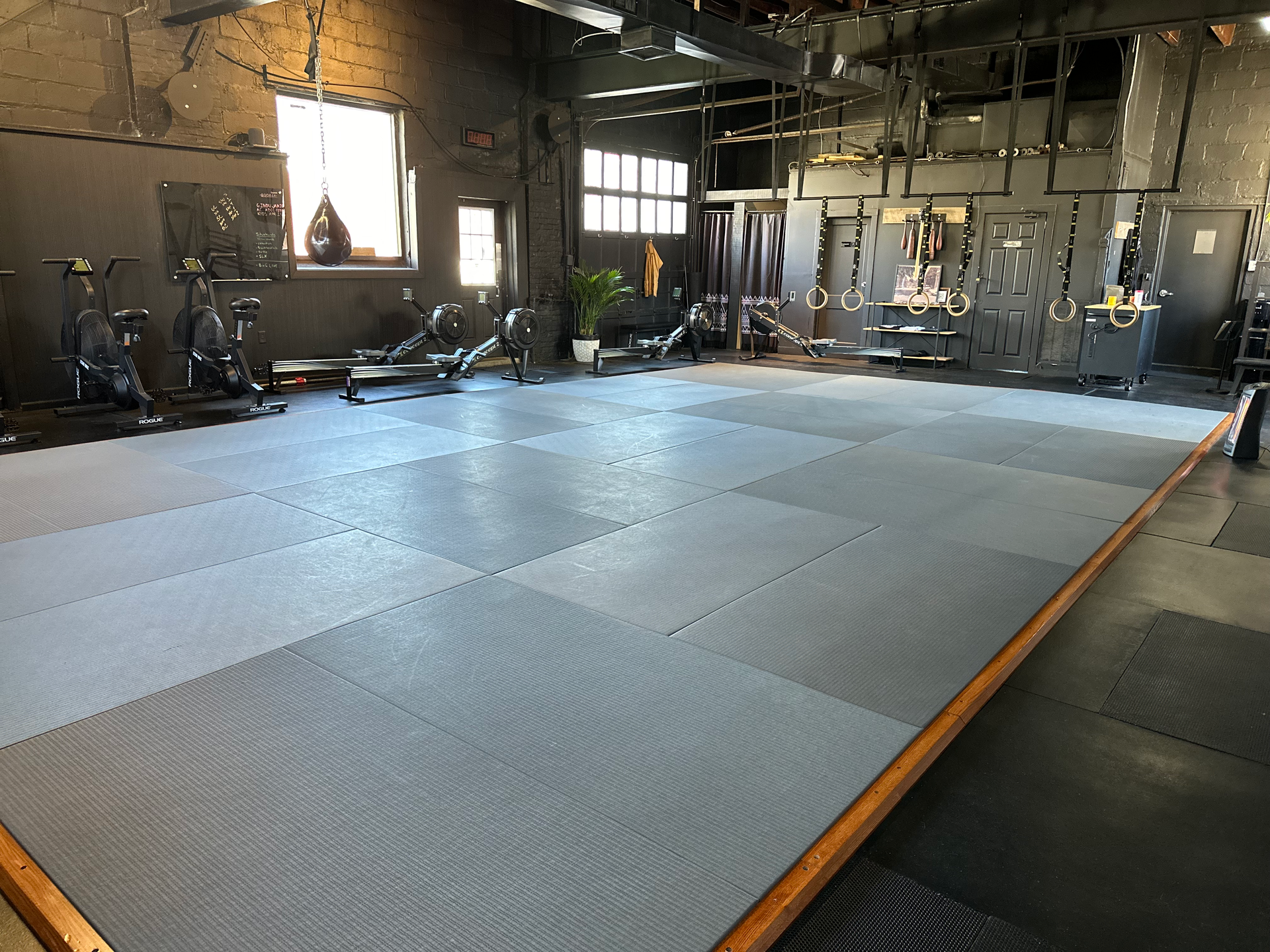 Adults practicing grappling drills at Bodega Jiu-Jitsu in Maplewood, NJ to build strength and confidence
