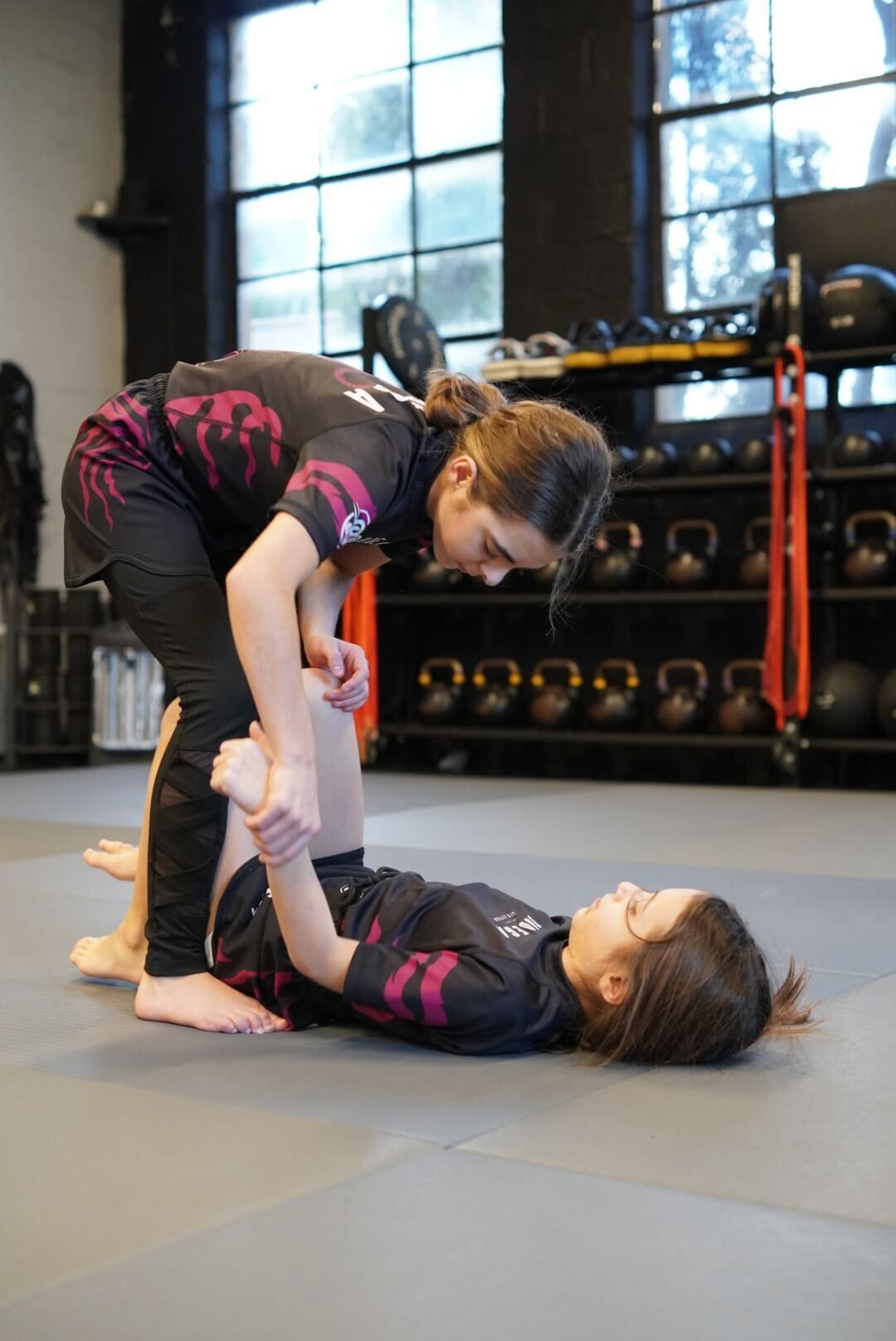 Kids partner-drilling in Youth Jiu-Jitsu at Bodega Jiu-Jitsu in Maplewood, NJ, building confidence and friendships.