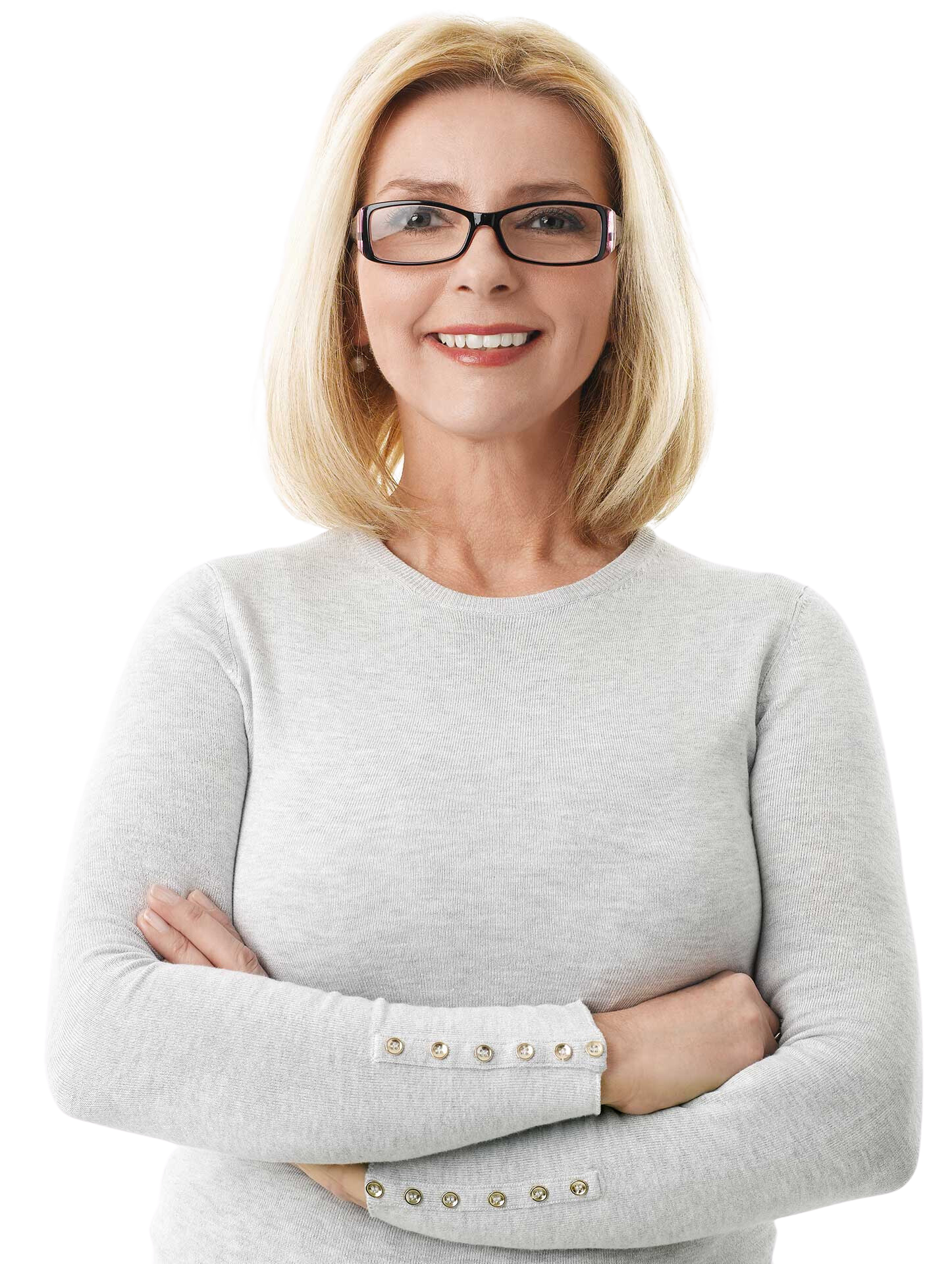 Woman with glasses, smiling, arms crossed, wearing a light-colored sweater.