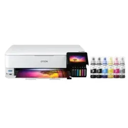 White Epson printer with ink bottles, color display, and printed output.