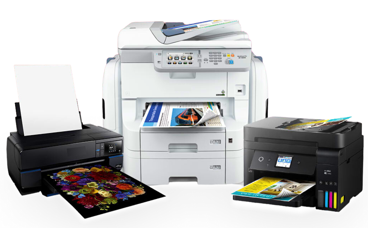 Three printers of different sizes printing various documents, including colorful photos.