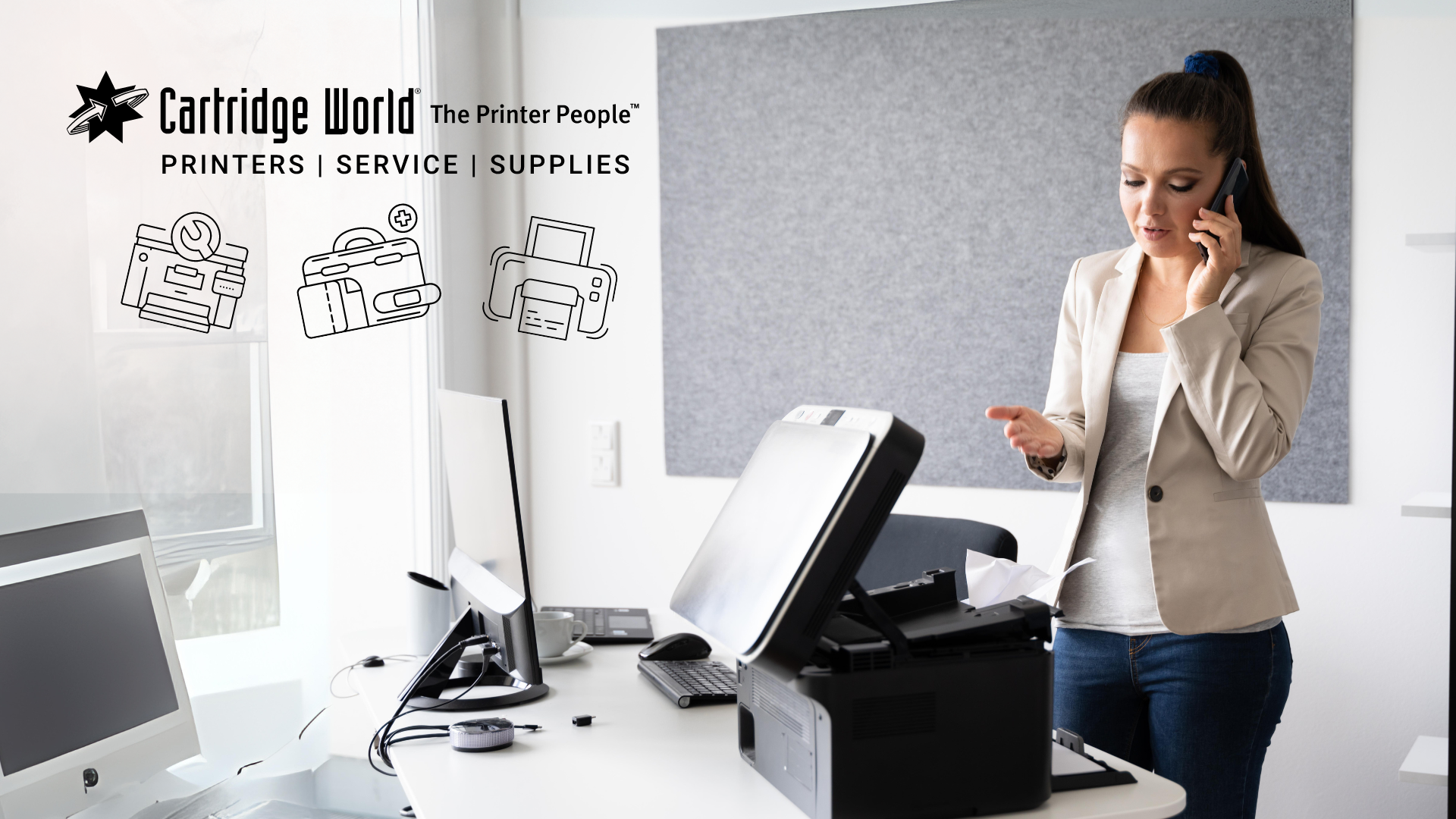 Woman on phone at office desk, printer, Cartridge World logo.