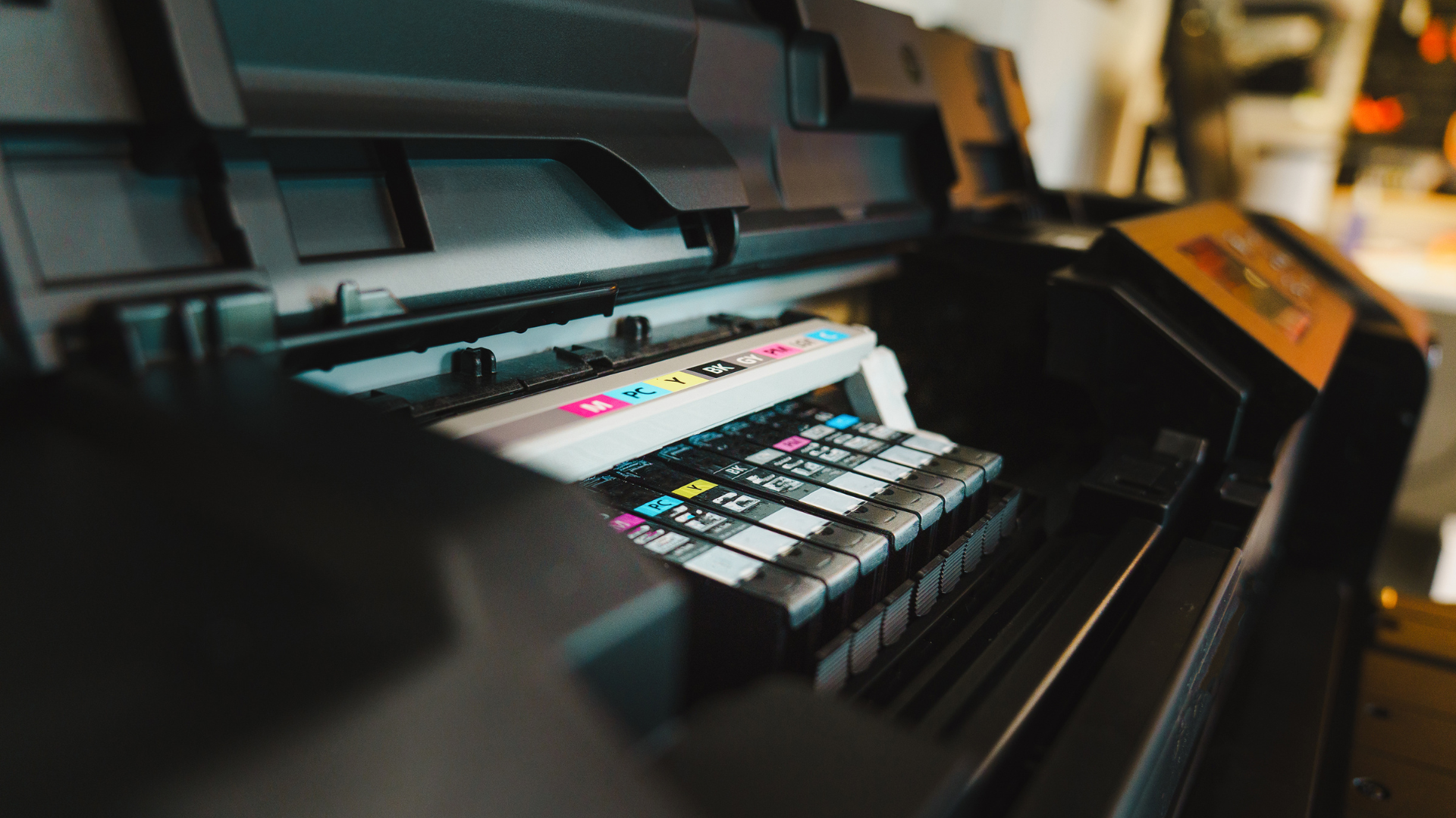 Ink cartridges inside a large format printer.