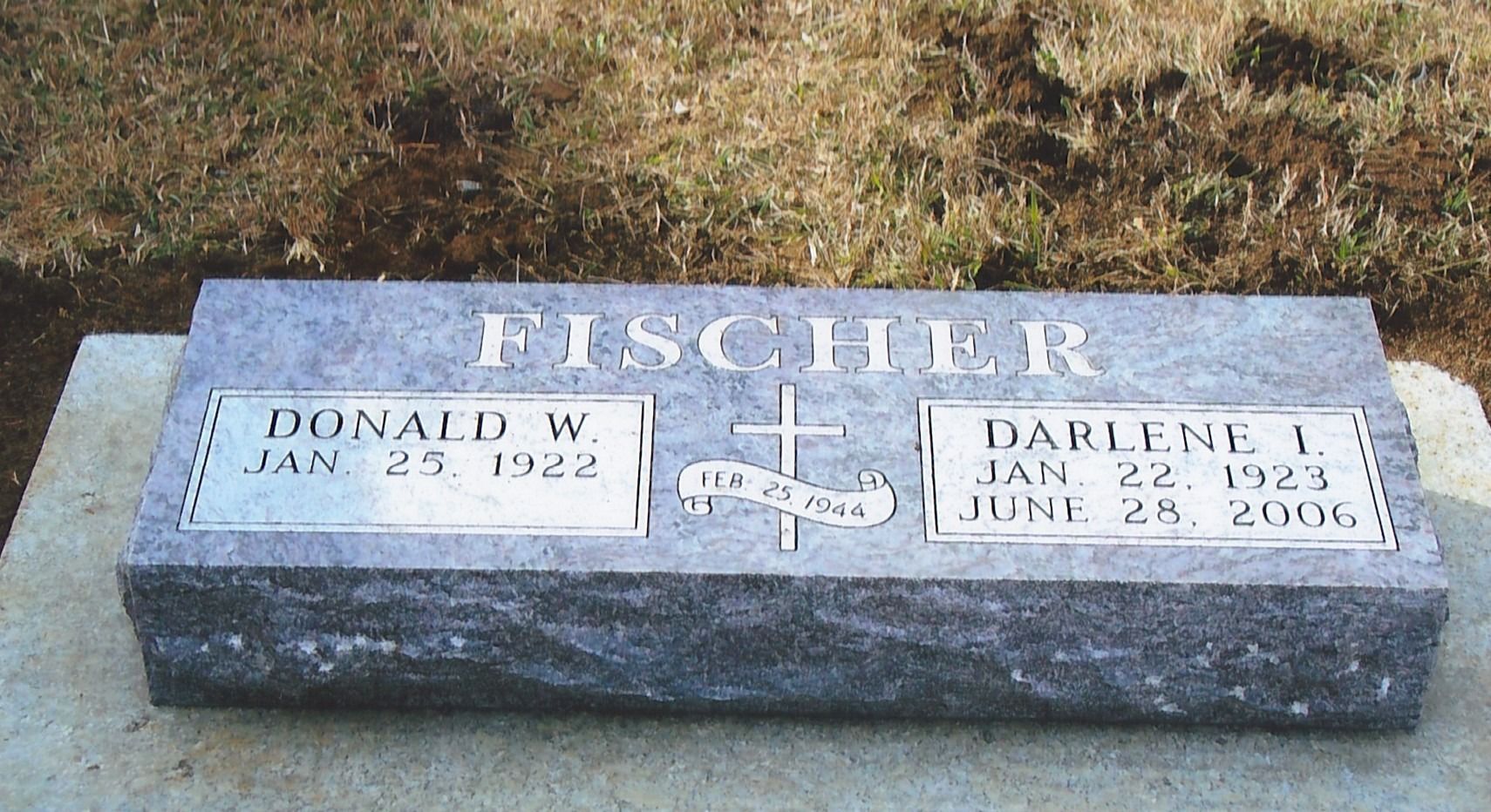 Fischer gravestone with two name plaques and a cross on a gray stone marker