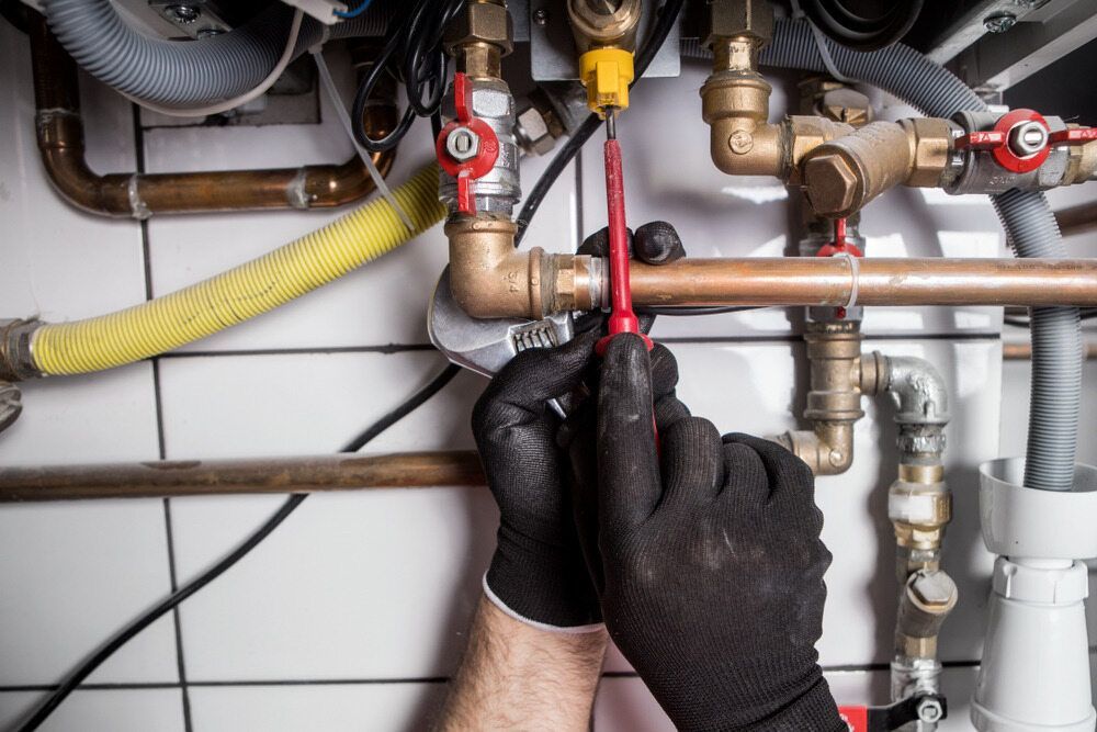 A Person That Repair a Gas Pipeline — FNQ Hot Water In Mareeba, QLD