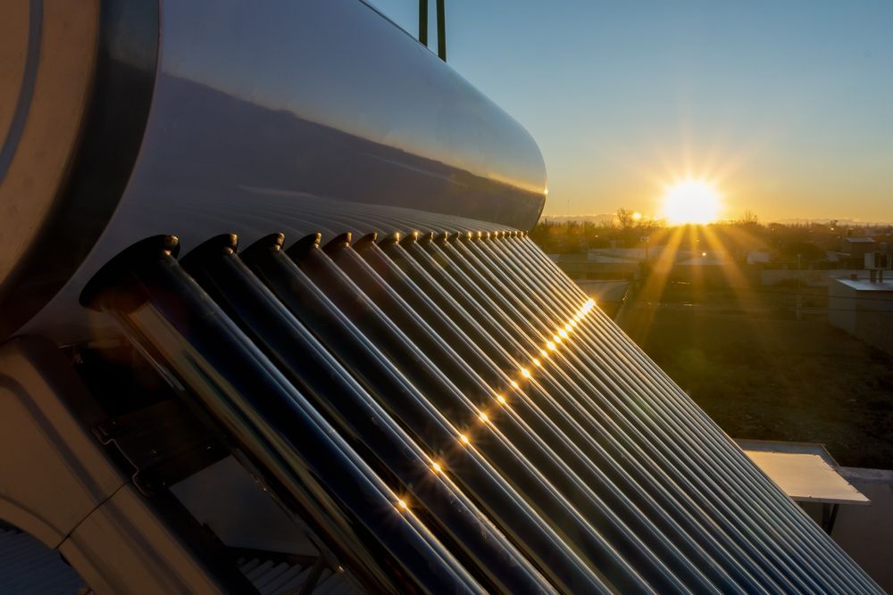 The Sun is Shining Through the Pipes of a Solar Water Heater — FNQ Hot Water In Mareeba, QLD
