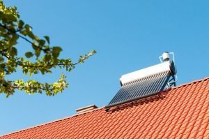 A Solar Water Heater is on the Roof of a House — FNQ Hot Water In Cairns, QLD