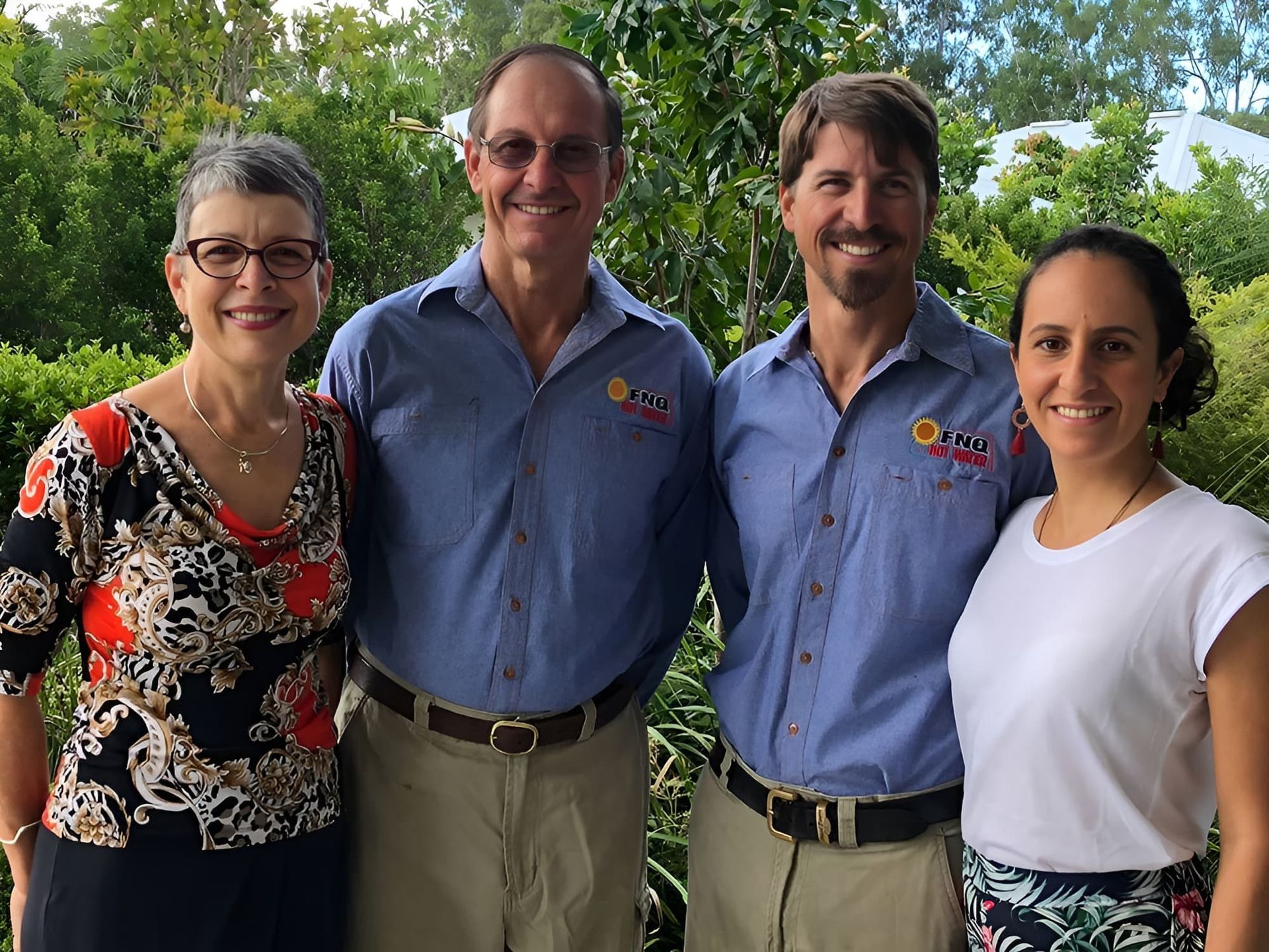 A Group of People Are Posing for a Picture Together — FNQ Hot Water In Mareeba, QLD