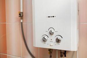 A White Gas Water Heater is Attached to a Wall in a Bathroom — FNQ Hot Water In Atherton, QLD