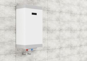 A White Water Heater is Hanging on a Tiled Wall — FNQ Hot Water In Mareeba, QLD