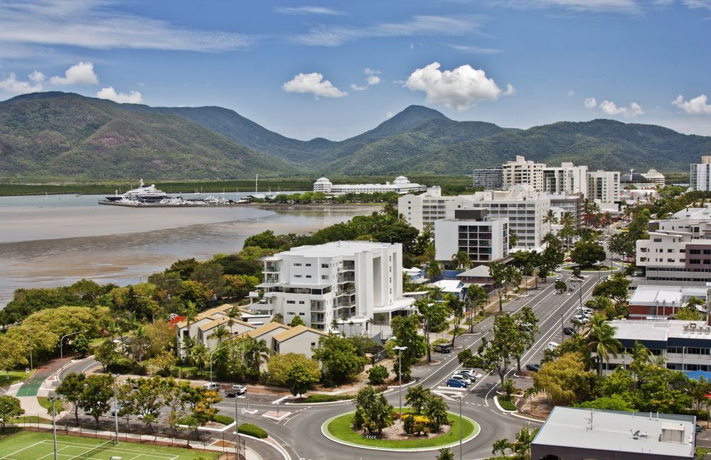 An Aerial View of a City With Mountains in the Background — FNQ Hot Water In Cairns, QLD