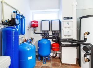 A Room With a Lot of Blue Tanks and Pipes — FNQ Hot Water In Atherton, QLD