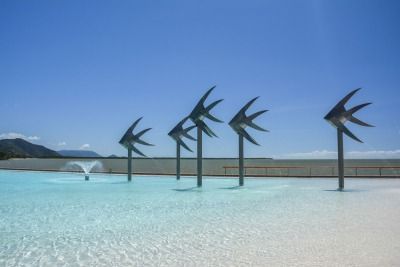 A Swimming Pool With a Fountain in the Middle of It — FNQ Hot Water In Cairns, QLD