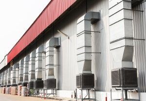 A Large Building With a Lot of Air Conditioners on the Side of It — FNQ Hot Water In Mareeba, QLD