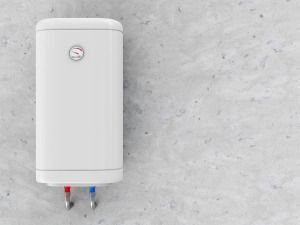 A White Water Heater is Hanging on a Concrete Wall — FNQ Hot Water In Cairns, QLD
