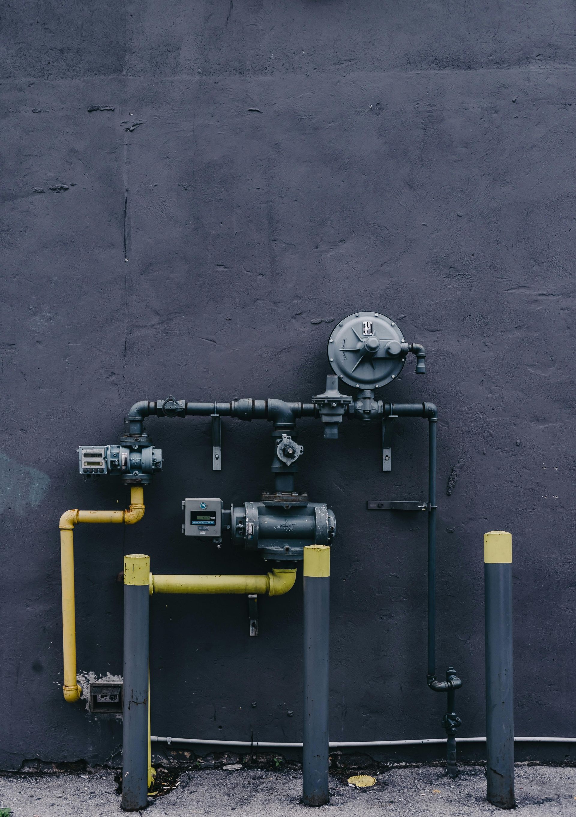 A Wall With a Bunch of Pipes Attached to It — FNQ Hot Water In Mareeba, QLD
